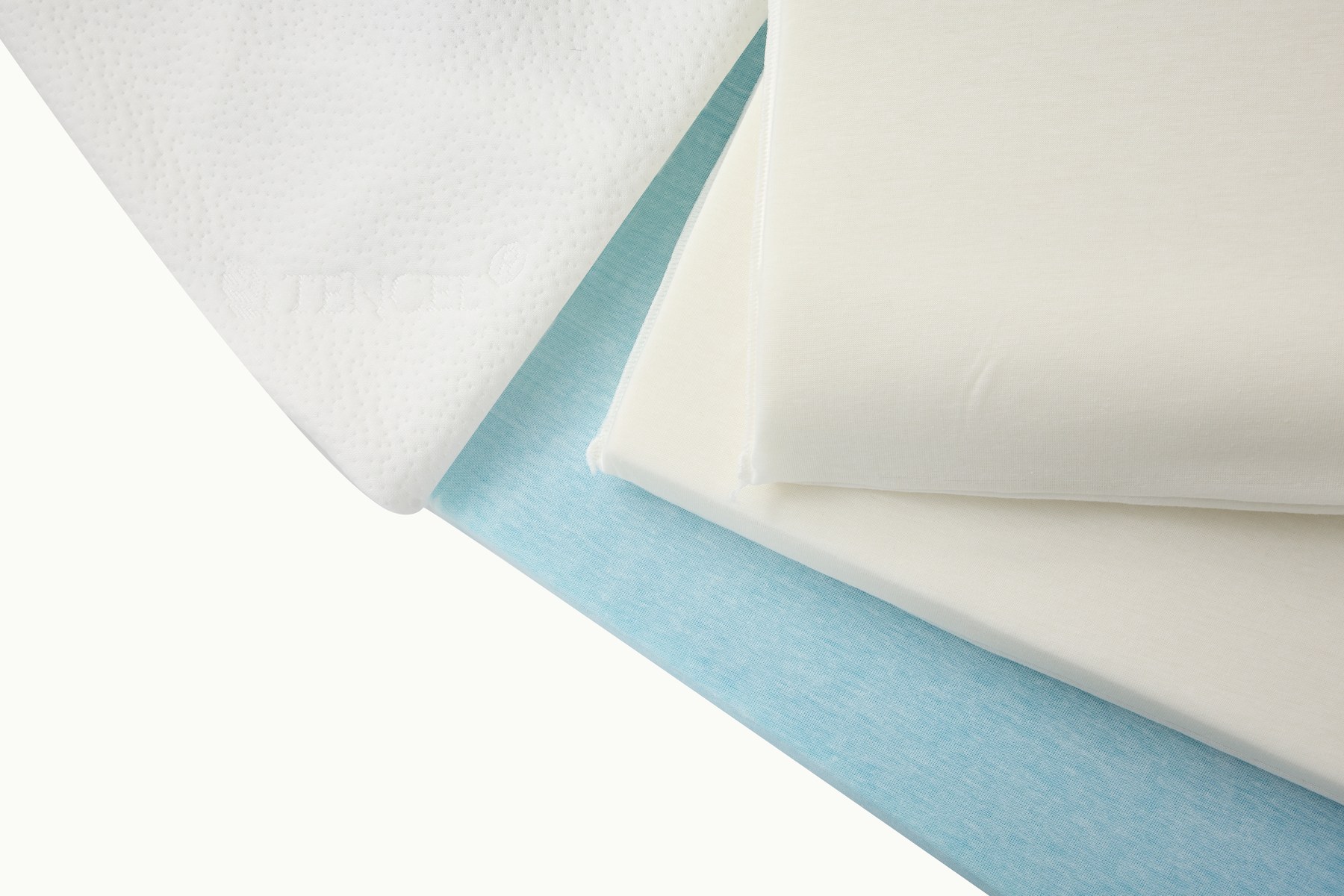 Close-up of the adjustable pillow layers and fabric construction